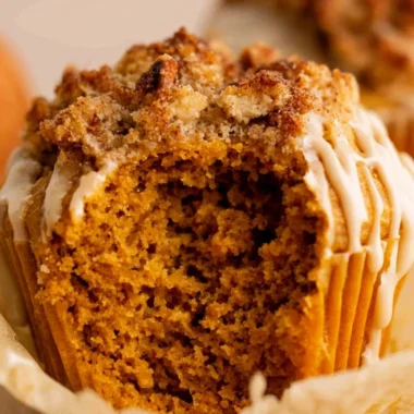Freshly baked gluten free pumpkin muffins on a rustic table.