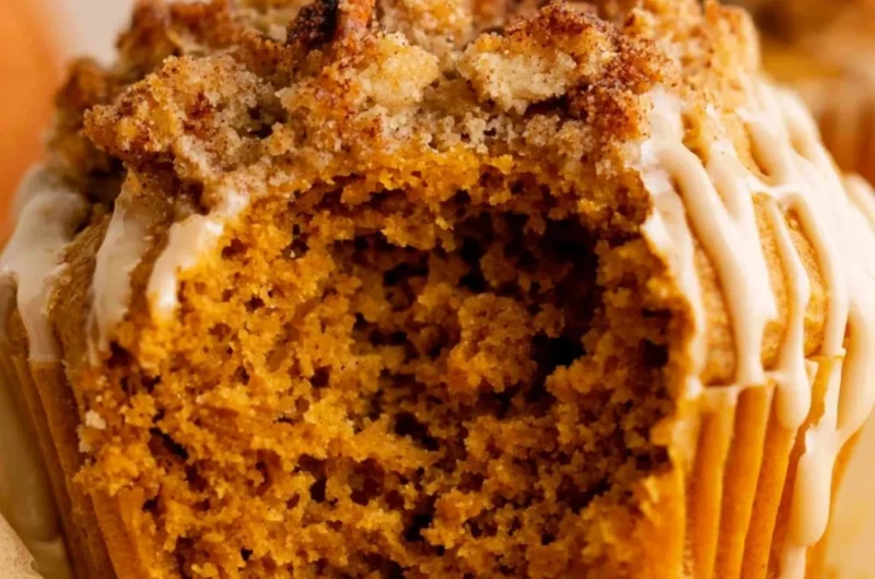 Freshly baked gluten free pumpkin muffins on a rustic table.