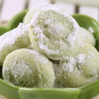 Delicious soft pistachio wedding cookies arranged on a festive platter